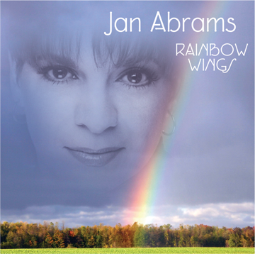 CD cover of ghosted face caressed by rainbow